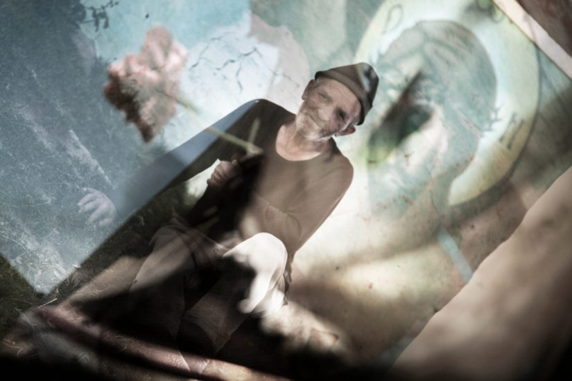 April Mountfort photograph from the Transylvania – Faded House series: Man + Christ #1