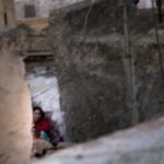 April Mountfort photographs – Hidden series: Young Woman on Roof #1