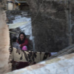 April Mountfort photographs – Hidden series: Young Woman on Roof #5