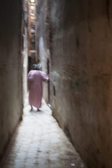April Mountfort photographs – Hidden series: Old Woman in Passage #2